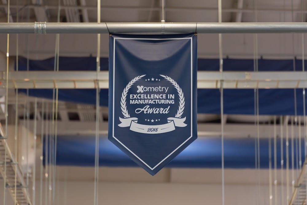 the 2018 Xometry Excellence in Manufacturing Award earned by SiMT