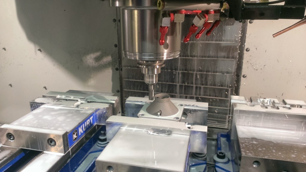 Trimming off the support structure made easier using our in-house machining capabilities. We pathed around the piece with an endmill and used a small cutter to remove any residual material underneath the lip.