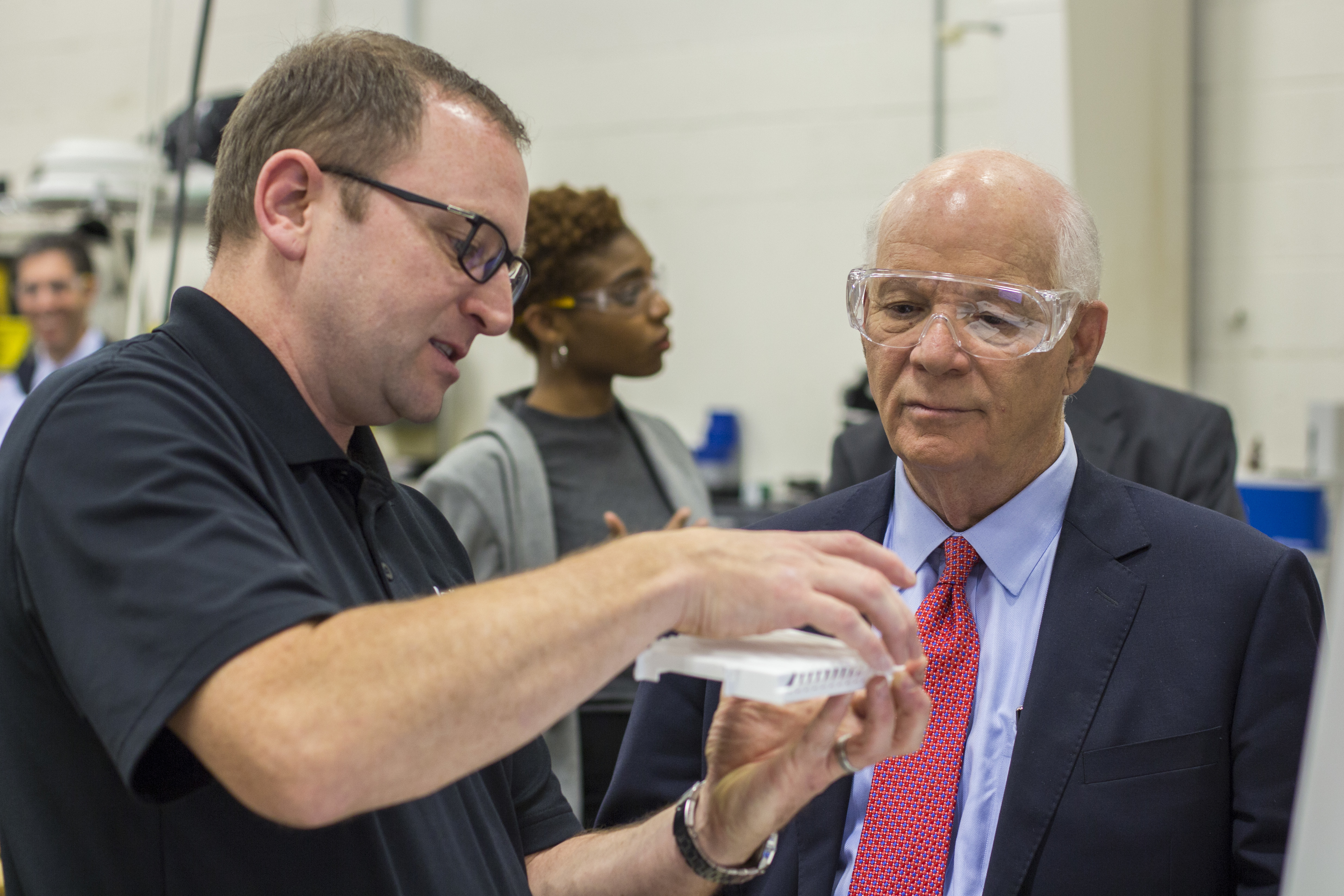 Senator Ben Cardin viewing a 3D Printed part at the Xometry additive manufacturing facility with Dave Tedder. Senator Ben Cardin viewing a 3D Printed part at the Xometry additive manufacturing facility with Dave Tedder.