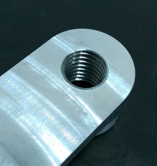 A threaded hole in a CNC part