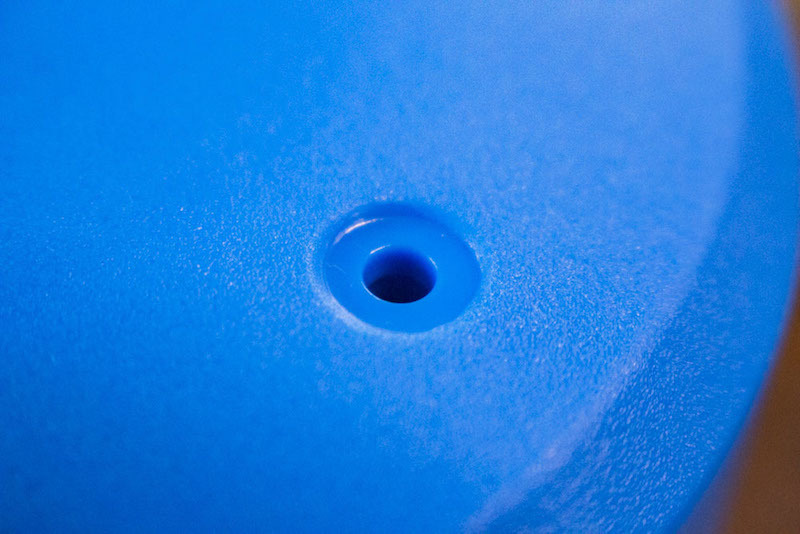 Close-up of a molded part with a stone matte finish